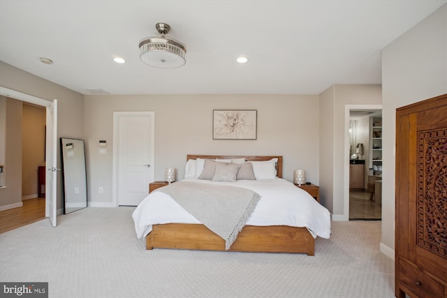 bedroom featuring baseboards, recessed lighting, and light colored carpet