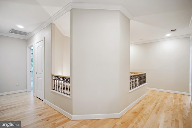 hall with wood finished floors, visible vents, recessed lighting, and crown molding