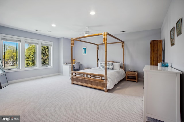 carpeted bedroom with ceiling fan, baseboards, visible vents, and recessed lighting