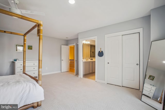 bedroom featuring light carpet, baseboards, recessed lighting, a closet, and connected bathroom
