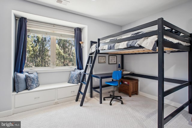carpeted bedroom featuring baseboards and visible vents