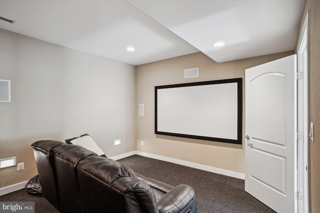 home theater featuring recessed lighting, dark carpet, visible vents, and baseboards