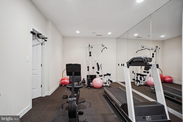 workout room with baseboards and recessed lighting