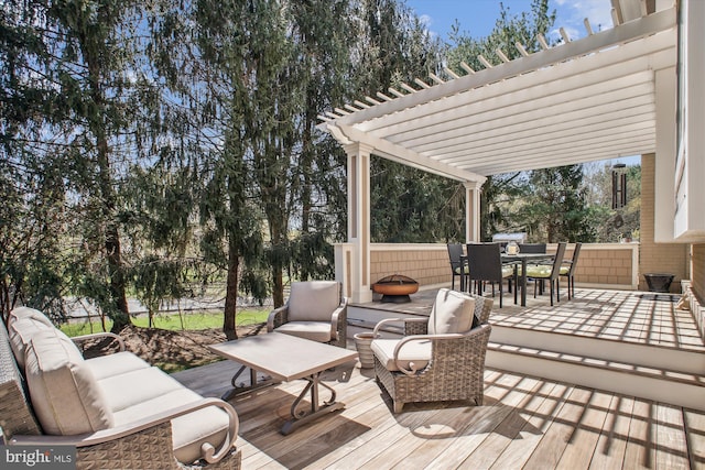 wooden deck featuring outdoor dining space, an outdoor living space, and a pergola