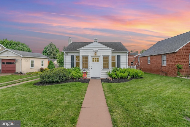 4403 Lancaster St, Harrisburg, PA 17111 - bungalow featuring a lawn and a chimney