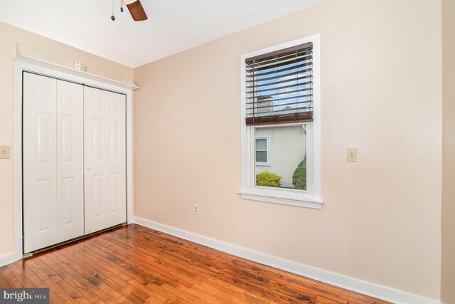 4403 Lancaster St, Harrisburg, PA 17111 - unfurnished bedroom featuring multiple windows, baseboards, and wood finished floors