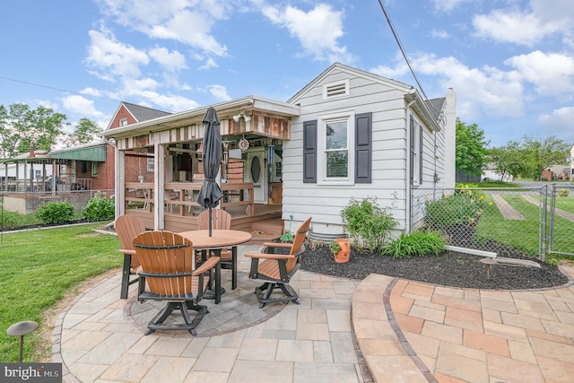4403 Lancaster St, Harrisburg, PA 17111 - back of property featuring a patio, a chimney, outdoor dining space, and a gate