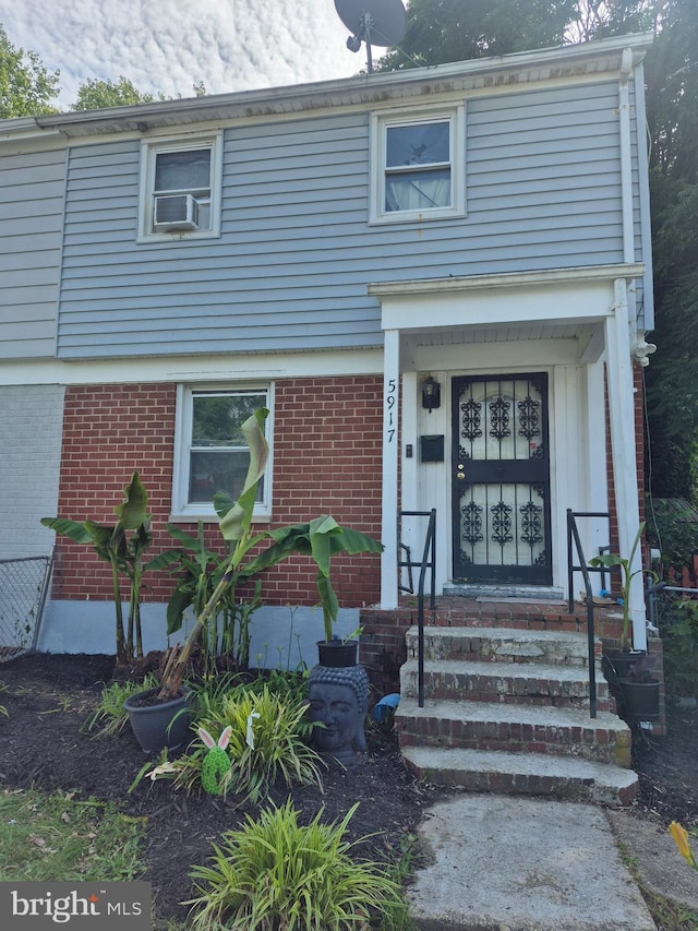 5917 Ottawa St, Oxon Hill, MD 20745 - view of exterior entry with brick siding and cooling unit