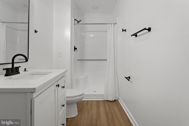 5235 Chalk Point Rd, West River, MD 20778 - bathroom with toilet, vanity, wood finished floors, curtained shower, and crown molding