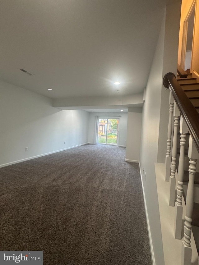 carpeted spare room with recessed lighting, visible vents, baseboards, and stairs