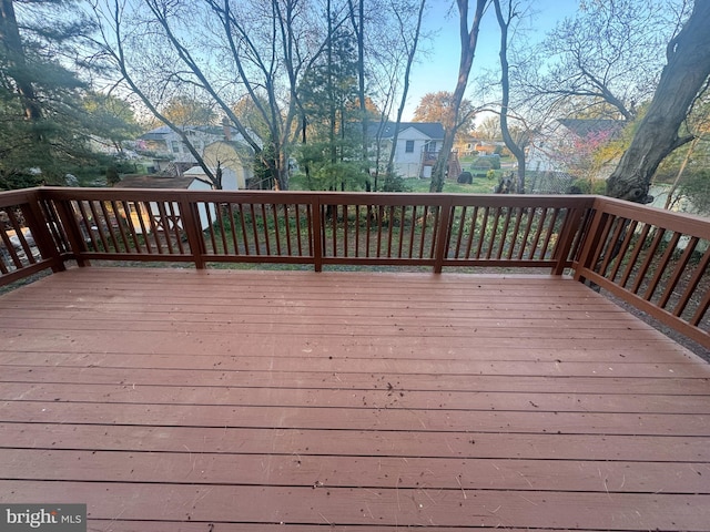 wooden deck featuring a residential view