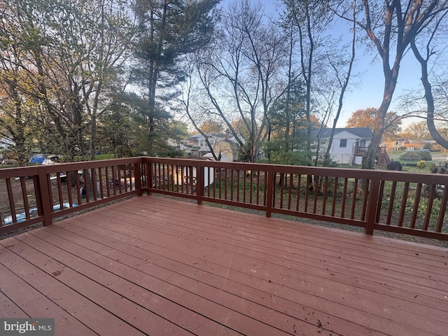 wooden deck featuring a residential view