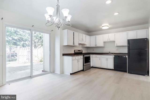 kitchen featuring white cabinets, dark countertops, black appliances, and light wood-type flooring