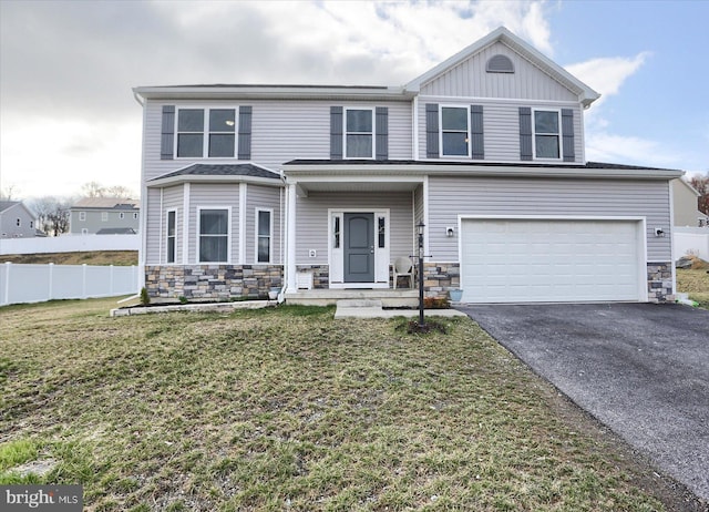 20 Steeple Chase Dr, York Haven, PA 17370 - view of front of property with driveway, stone siding, an attached garage, fence, and a front lawn
