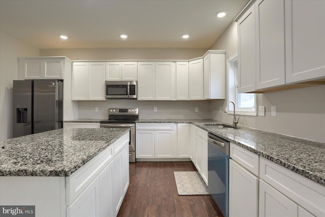 20 Steeple Chase Dr, York Haven, PA 17370 - kitchen featuring dark wood finished floors, appliances with stainless steel finishes, stone counters, a sink, and white cabinetry