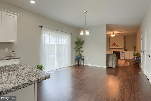 20 Steeple Chase Dr, York Haven, PA 17370 - dining space featuring a fireplace, dark wood-style flooring, recessed lighting, and ceiling fan with notable chandelier
