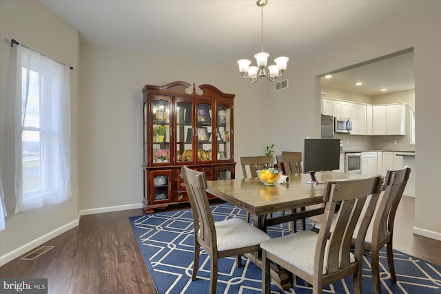 20 Steeple Chase Dr, York Haven, PA 17370 - dining space featuring an inviting chandelier, dark wood-style flooring, visible vents, and baseboards