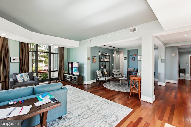 4301 Military Rd NW Unit 202, Washington, DC 20015 - living room with visible vents, baseboards, and wood finished floors