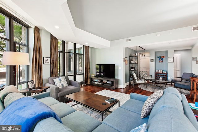 4301 Military Rd NW Unit 202, Washington, DC 20015 - living area with baseboards, plenty of natural light, wood finished floors, and visible vents