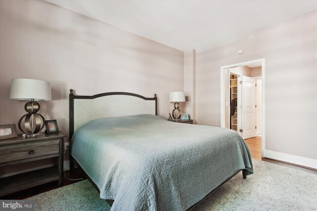 4301 Military Rd NW Unit 202, Washington, DC 20015 - bedroom featuring baseboards and wood finished floors