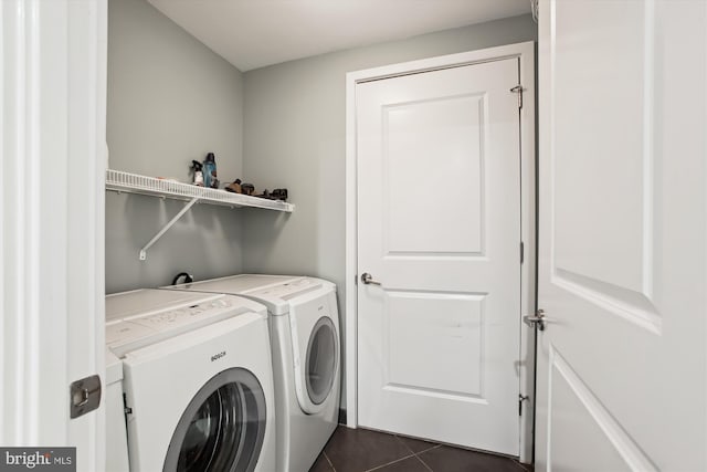 4301 Military Rd NW Unit 202, Washington, DC 20015 - washroom featuring washing machine and clothes dryer, dark tile patterned flooring, and laundry area