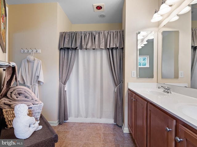 154 N Landis Way N, Wilmington, DE 19803 - full bathroom featuring double vanity, baseboards, and a sink