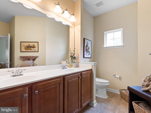 154 N Landis Way N, Wilmington, DE 19803 - bathroom featuring visible vents, a sink, double vanity, and toilet