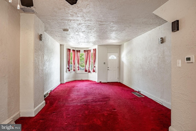 333 E Miner St, West Chester, PA 19382 - carpeted empty room with a textured wall, a textured ceiling, and baseboards