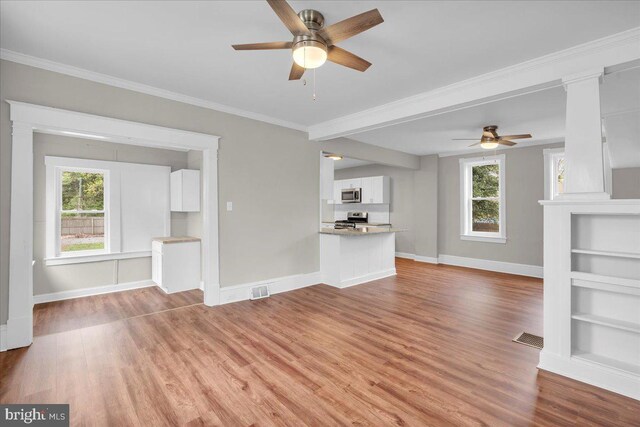 905 Cooper, Edgewater Park, NJ 08010 - unfurnished living room with baseboards, a ceiling fan, and a wealth of natural light