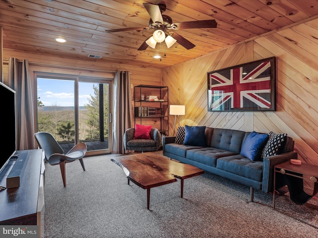 2201 Mill Gap Rd, Lost City, WV 26810 - living area with wood walls, wooden ceiling, carpet flooring, and a ceiling fan