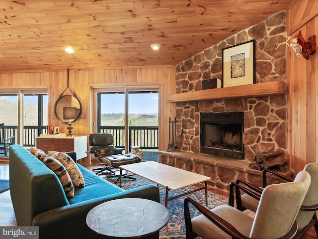 2201 Mill Gap Rd, Lost City, WV 26810 - living room featuring wooden ceiling, a healthy amount of sunlight, wooden walls, and a fireplace