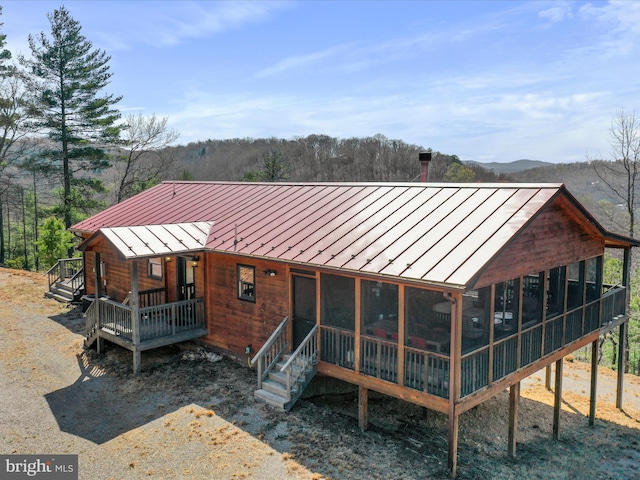 2201 Mill Gap Rd, Lost City, WV 26810 - rear view of property featuring a standing seam roof, a deck, a sunroom, and metal roof