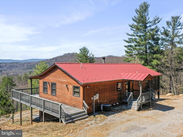 2201 Mill Gap Rd, Lost City, WV 26810 - view of front of home featuring central air condition unit, a deck with mountain view, and metal roof