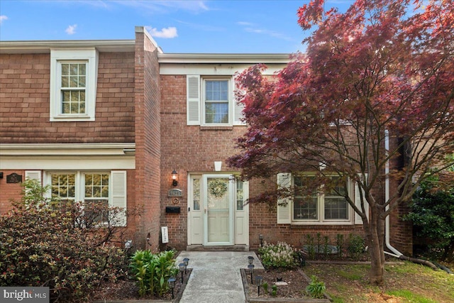 view of property with brick siding