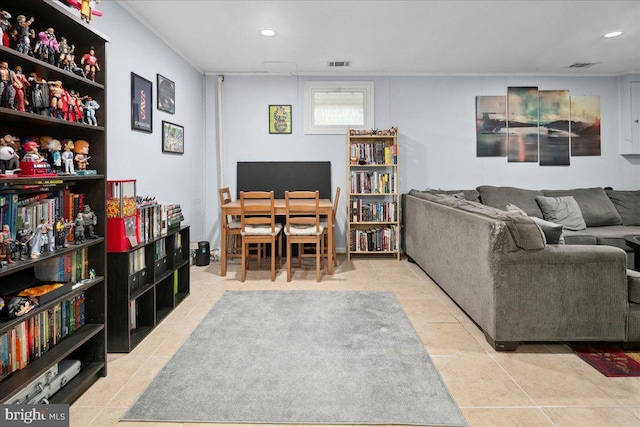 living room featuring tile patterned floors, visible vents, and recessed lighting