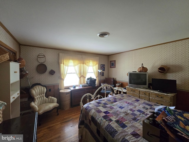 938 Church Hill Rd, Milford, DE 19963 - bedroom featuring ornamental molding, visible vents, wood finished floors, and wallpapered walls