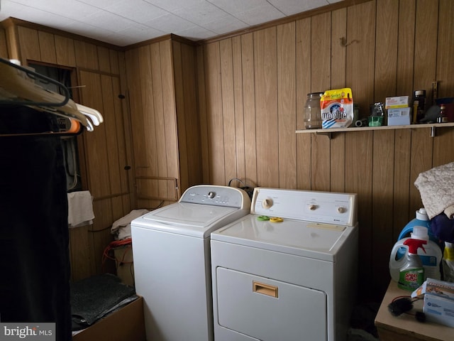 938 Church Hill Rd, Milford, DE 19963 - laundry area featuring wooden walls, washing machine and clothes dryer, and laundry area