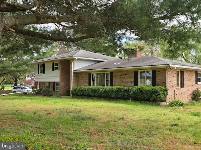 938 Church Hill Rd, Milford, DE 19963 - tri-level home featuring brick siding, a front yard, and a chimney