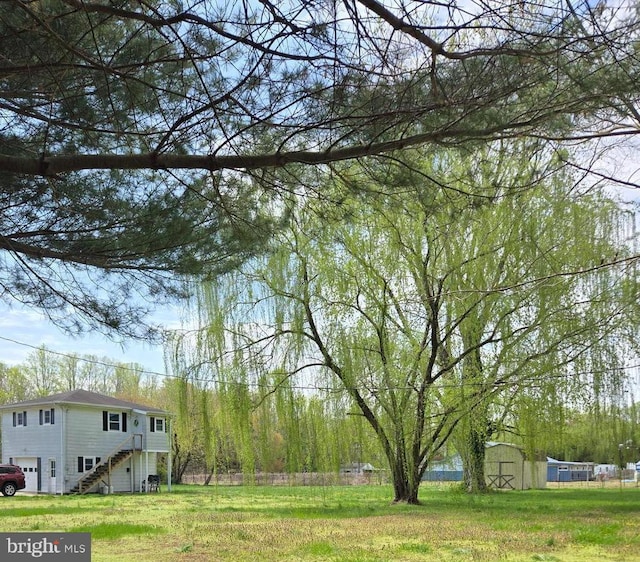938 Church Hill Rd, Milford, DE 19963 - view of yard featuring stairs and an attached garage