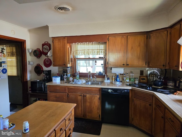 938 Church Hill Rd, Milford, DE 19963 - kitchen featuring black dishwasher, light countertops, backsplash, and visible vents