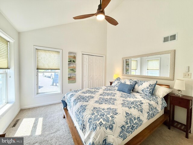 477 Wampum Ln, Hedgesville, WV 25427 - carpeted bedroom featuring visible vents, a ceiling fan, a closet, and high vaulted ceiling