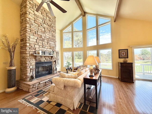 477 Wampum Ln, Hedgesville, WV 25427 - living room featuring a ceiling fan, hardwood / wood-style flooring, beam ceiling, high vaulted ceiling, and baseboards
