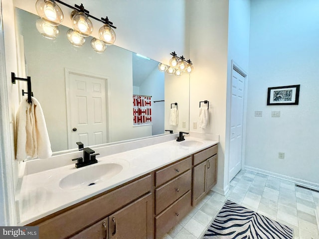 477 Wampum Ln, Hedgesville, WV 25427 - full bathroom featuring double vanity, a sink, baseboards, and tile patterned flooring