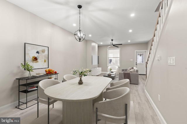 dining room with recessed lighting, stairway, light wood-type flooring, and baseboards
