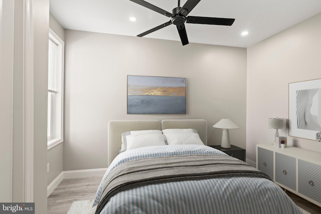 bedroom featuring wood finished floors, ceiling fan, baseboards, and recessed lighting