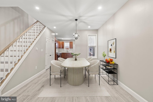 dining space with recessed lighting, stairway, light wood-style flooring, and baseboards