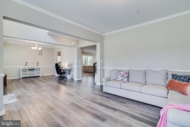 13301 Windjammer Ct, Hughesville, MD 20637 - living area with a chandelier, light wood-style floors, crown molding, and a wainscoted wall