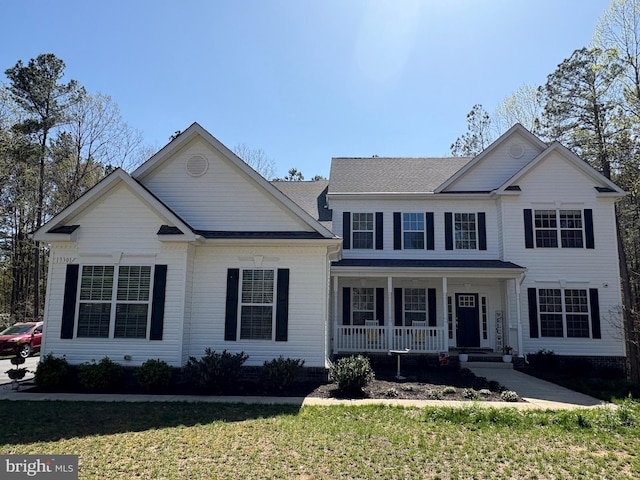 13301 Windjammer Ct, Hughesville, MD 20637 - view of front of home featuring a porch and a front yard