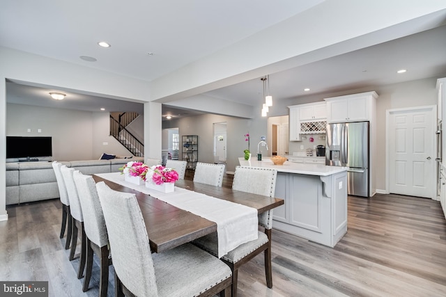 13301 Windjammer Ct, Hughesville, MD 20637 - dining area with baseboards, wood finished floors, recessed lighting, and stairs