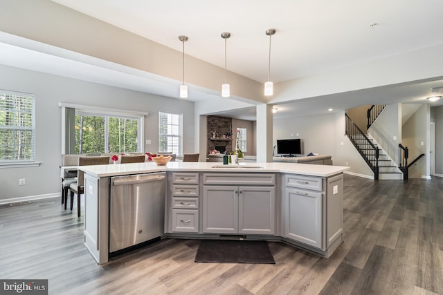 13301 Windjammer Ct, Hughesville, MD 20637 - kitchen featuring light countertops, dishwasher, open floor plan, and a sink